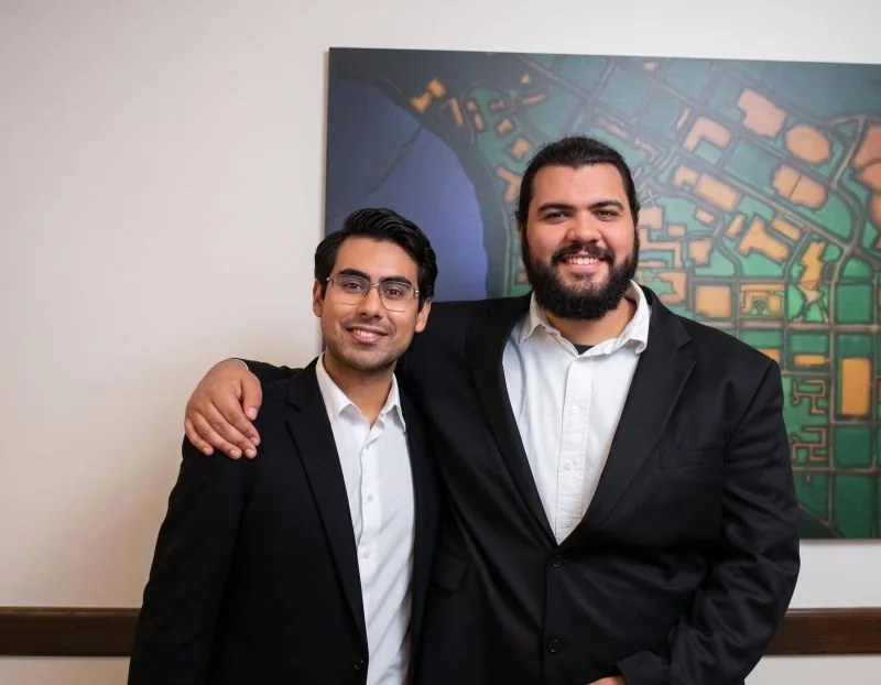 Two people posing at Gopher AI Demo Night on April 9, 2026 at Coffman Memorial Union
