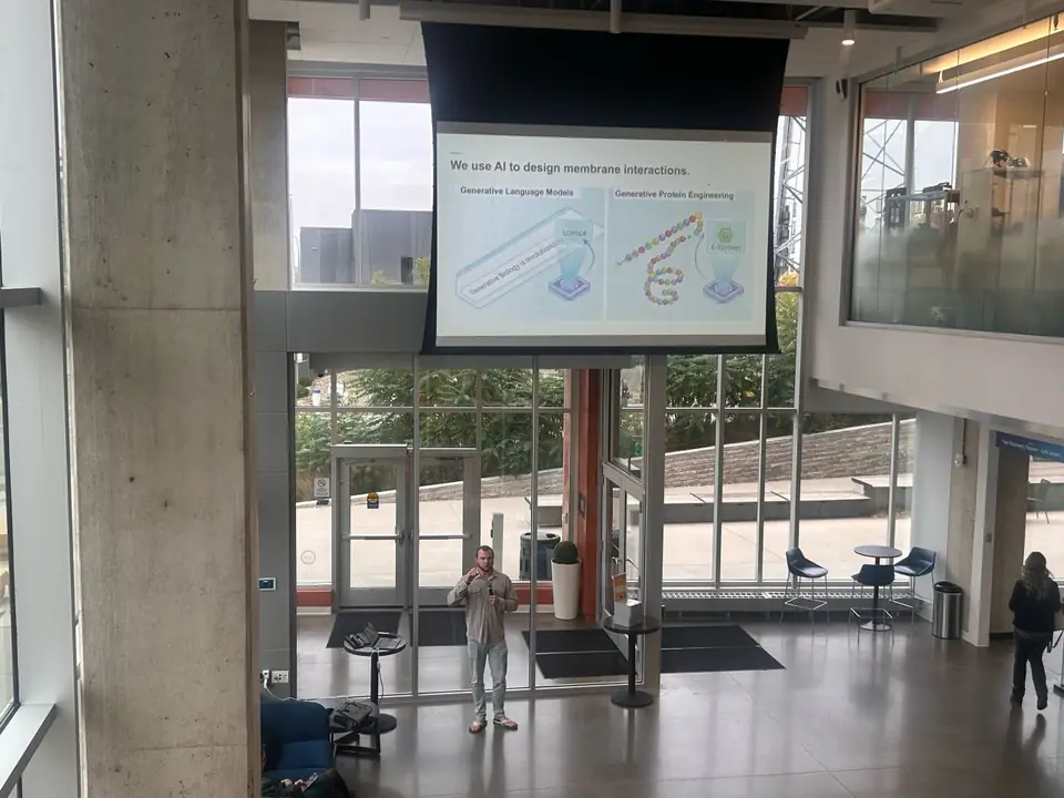 Wide view of the stage and screen at Wild AI x BiotechMN on October 14, 2026 in Rochester