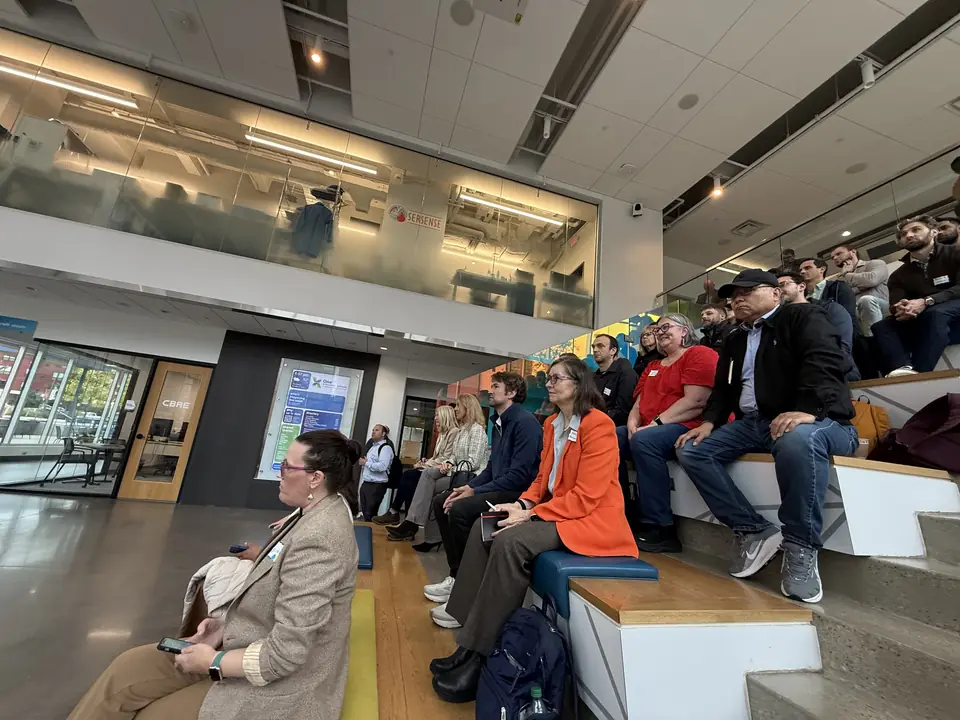 Audience in the bleachers at Wild AI x BiotechMN on October 14, 2026 in Rochester